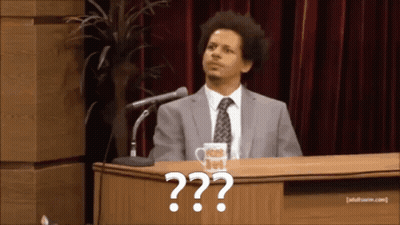 Two Men In Suits At Table With Adult Swim Mug GIF