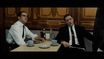 Two Men In Suits At Table With Food And Coffee GIF