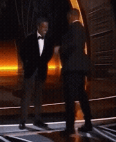 Two Men In Suits Dancing On Stage GIF