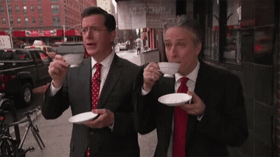 Two Men In Suits Drinking Coffee GIF