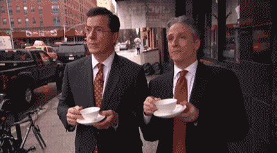 Two Men In Suits Drinking Coffee Saying Bravo GIF