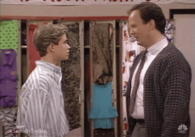 Two Men In Suits In Locker Room GIF
