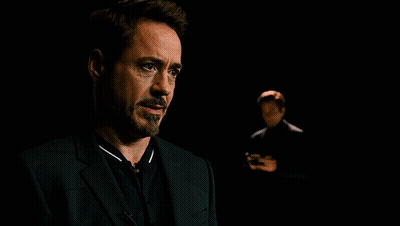 Two Men In Suits In The Dark GIF