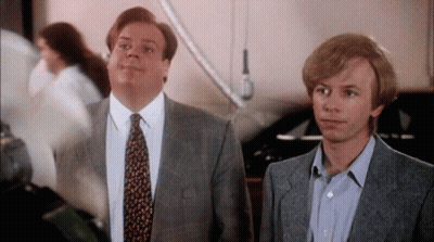 Two Men In Suits Making Funny Faces GIF