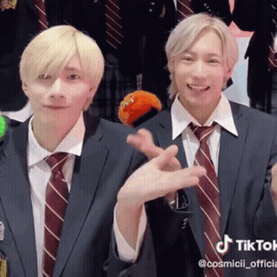 Two Men In Suits Making Peace Sign GIF