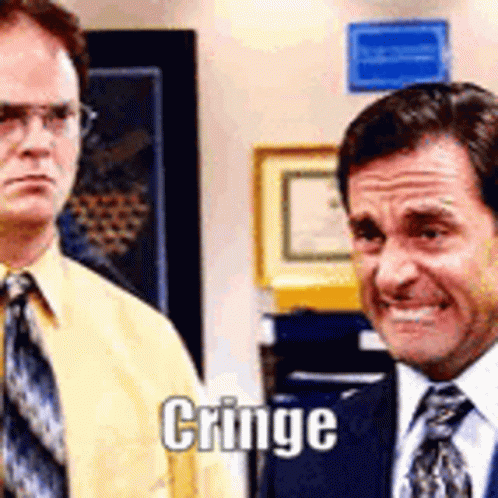 Two Men In Suits One Smiling One Making Face GIF