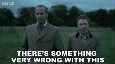 Two Men In Suits Saying Something Very Wrong GIF