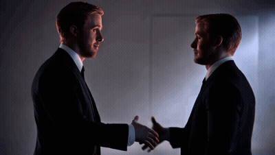 Two Men In Suits Shaking Hands GIF