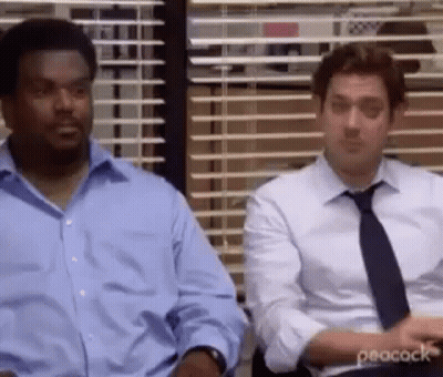 Two Men In Suits Sitting By Office Window GIF