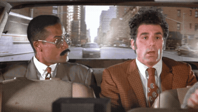 Two Men In Suits Sitting In Car Looking Out Window GIF
