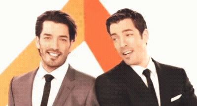 Two Men In Suits Smiling GIF