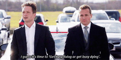 Two Men In Suits Standing Beside Car GIF