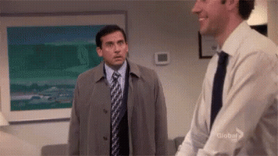 Two Men In Suits Standing In Office GIF