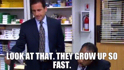 Two Men In Suits Standing In Store GIF