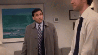 Two Men In Suits Standing Together GIF