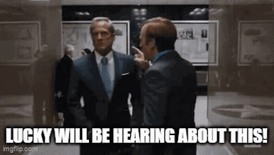 Two Men In Suits Talking In Hallway Lucky Will Be Hearing About This GIF
