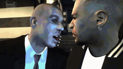 Two Men In Suits Talking GIF