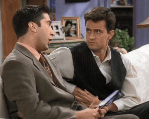 Two Men In Suits Talking GIF