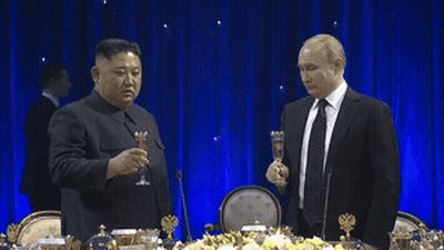 Two Men In Suits Toasting With Champagne GIF