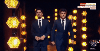 Two Men In Suits Walking Past Direct Reequipe Sign GIF
