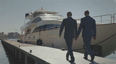 Two Men In Suits Walking Toward Boat Saying Shannon GIF