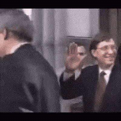 Two Men In Suits Waving GIF