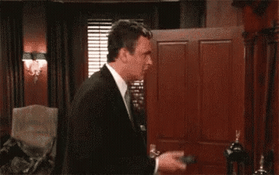 Two Men In Suits With Hands In Air GIF