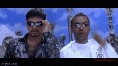 Two Men In Sunglasses Standing Together GIF