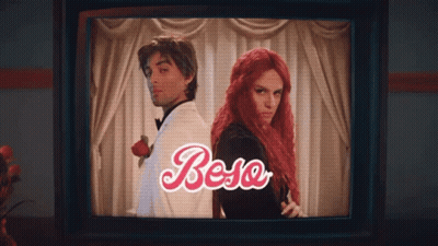 Two Men In Tie Dye And Pink Dancing GIF