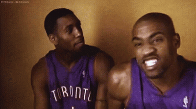 Two Men In Toronto Basketball Jerseys Sitting GIF