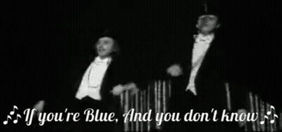 Two Men In Tuxedos And Top Hats On Stage GIF