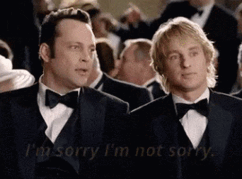 Two Men In Tuxedos Are Sitting Next To Each Other And One Of Them Says I 'M Sorry GIF