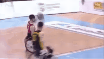 Two Men In Wheelchairs Playing Basketball GIF