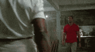 Two Men In White And Red Shirts Standing Together GIF