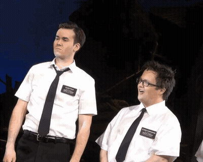 Two Men In White Shirts And Black Ties With Billy Smith Name Tag GIF