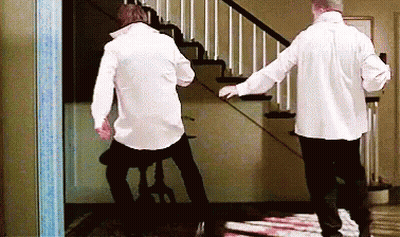 Two Men In White Shirts Walking Down Stairs GIF
