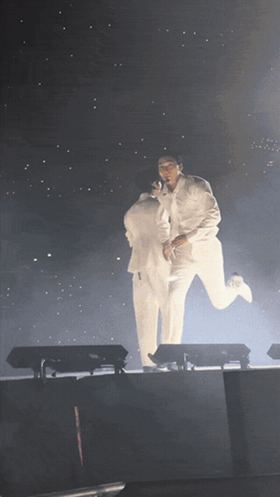Two Men In White Suits Holding GIF