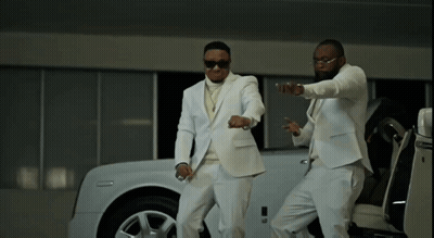 Two Men In White Suits Standing Next To White Car GIF