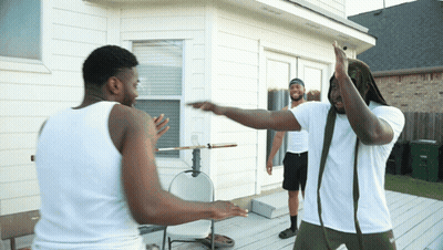 Two Men In White Tank Tops On Deck GIF