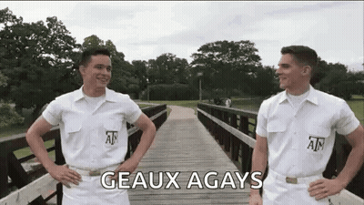 Two Men In White Uniforms Standing On A Bridge GIF