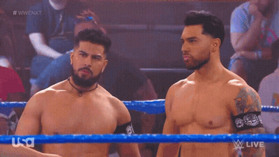 Two Men In Wrestling Ring, One With Tattoo GIF