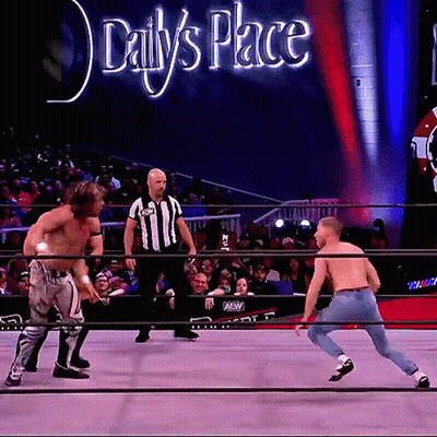 Two Men In Wrestling Ring With Daily's Place Sign GIF