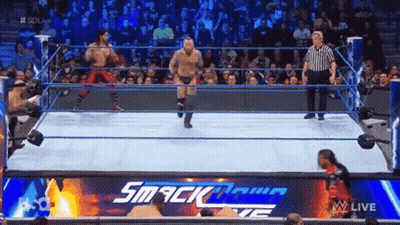 Two Men In Wrestling Ring With Referee GIF