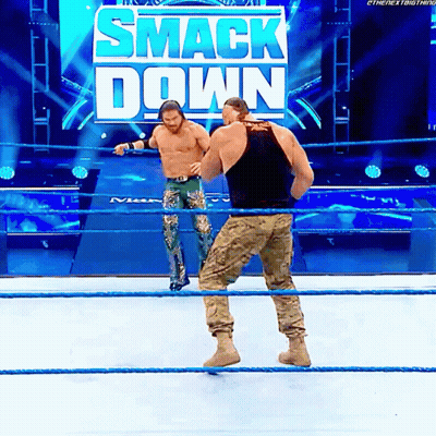 Two Men In Wrestling Ring With Smack Down Sign GIF