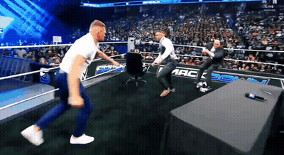 Two Men In Wrestling Ring With Smack GIF