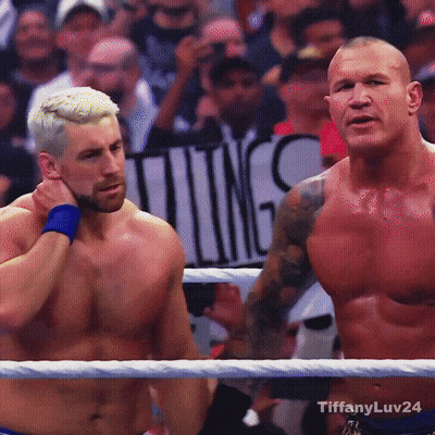 Two Men In Wrestling Ring With Ting Sign GIF