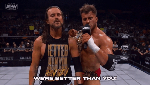 Two Men In Wrestling Ring With We're Better Than You GIF