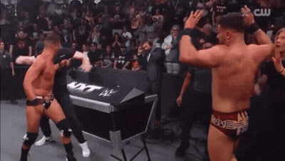 Two Men In Wrestling Trunks GIF