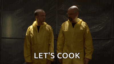 Two Men In Yellow Coveralls Are Standing Next To Each Other With The Words Let 'S Cook Written On The Bottom GIF