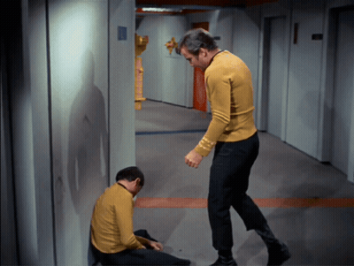 Two Men In Yellow Shirts Standing Together GIF
